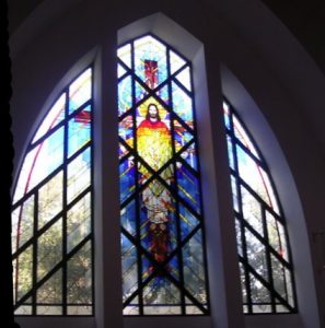 stained glass windows in St George began with the magnificent Christus Rex